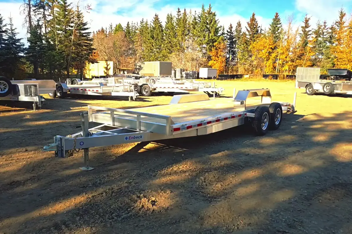Rows of Enbeck aluminum trailers on the Acheson Trailers lot